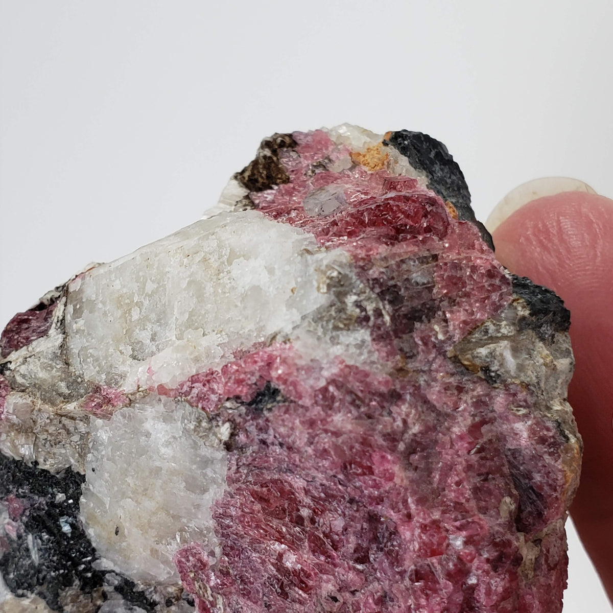  Eudialyte | Fluorescent under UV light | 170 grams | Mont Saint Hilaire, Québec, Canada 5