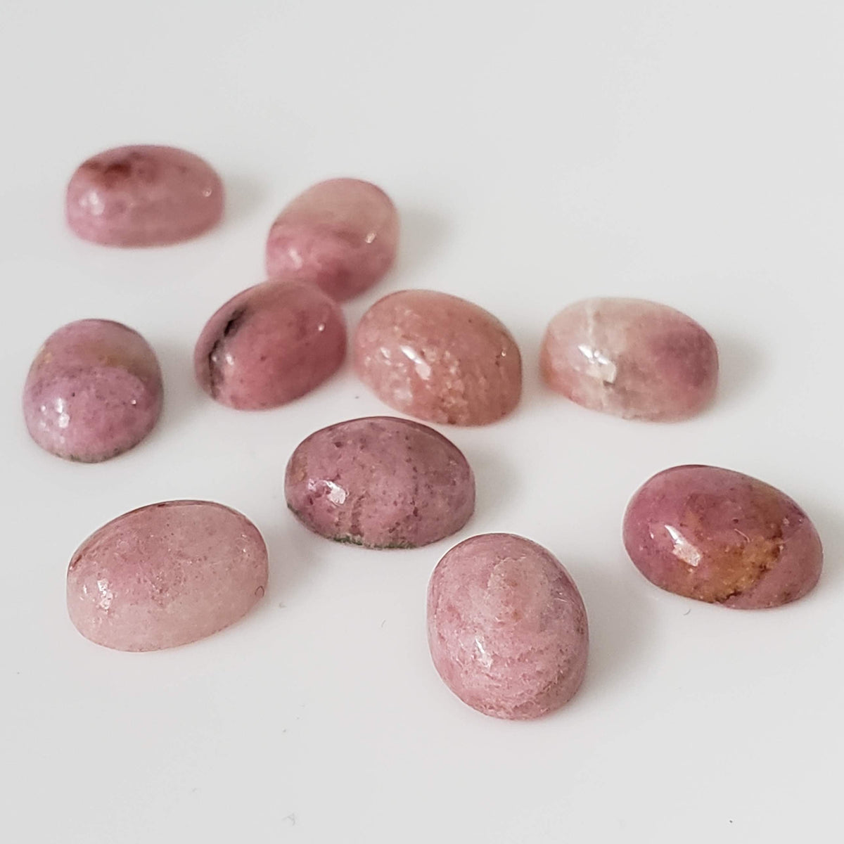 Rhodonite | 10 Piece Gemstone Lot | Oval Cabochon | Pink | 7.5-8.0x5.6-6.0mm 16.5tcw 0