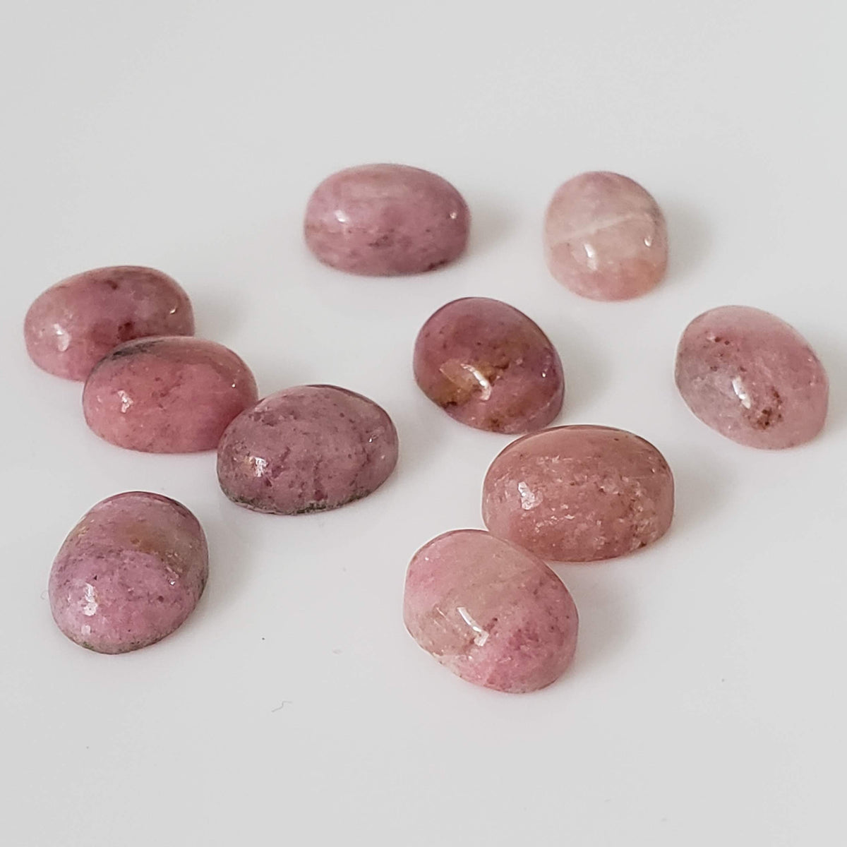 Rhodonite | 10 Piece Gemstone Lot | Oval Cabochon | Pink | 7.5-8.0x5.6-6.0mm 16.5tcw 1