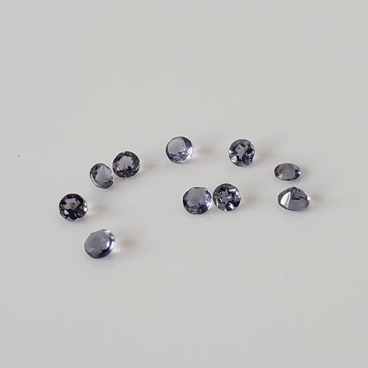 Iolite | 10 Piece Gemstone Lot | Round Cut | Blue Purple | 1.3-1.5mm 0.13tcw