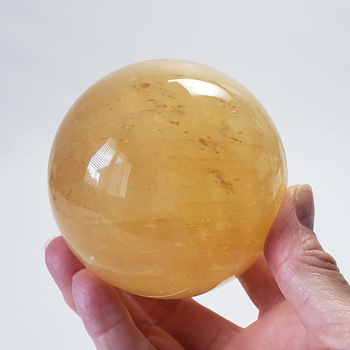  Amber Calcite Sphere 87 mm, 3.4 inches 952 grams China 