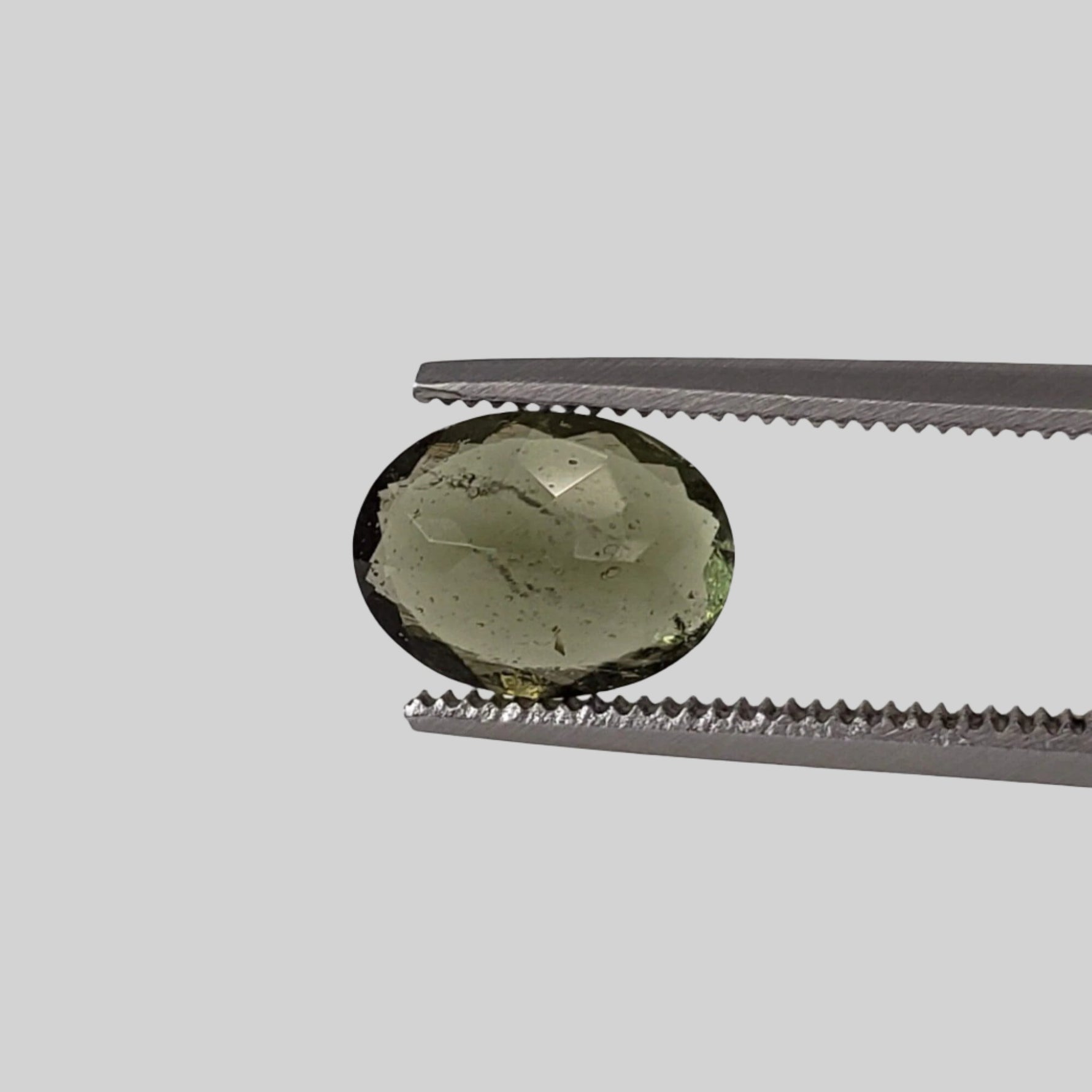  Authentic Moldavite | Oval Cut | 8x6mm | Chlum Region, Czech Republic | SO24 1