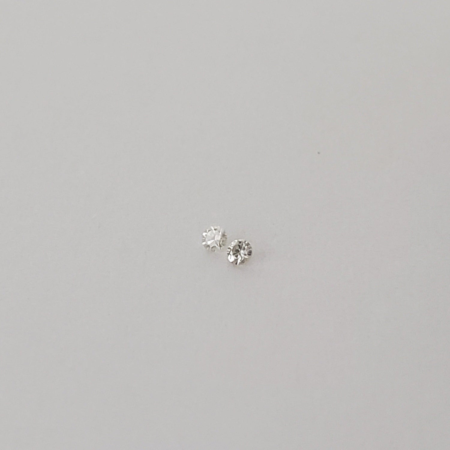  Pair of Moissanite | Round Diamond Cut | White | 1.2mm | SO24 