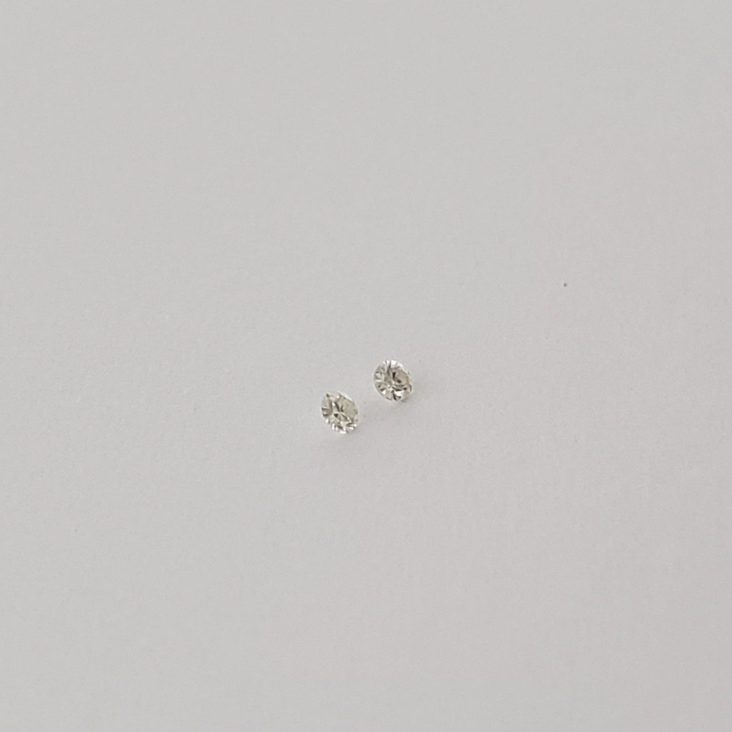  Pair of Moissanite | Round Diamond Cut | White | 1.2mm | SO24 1