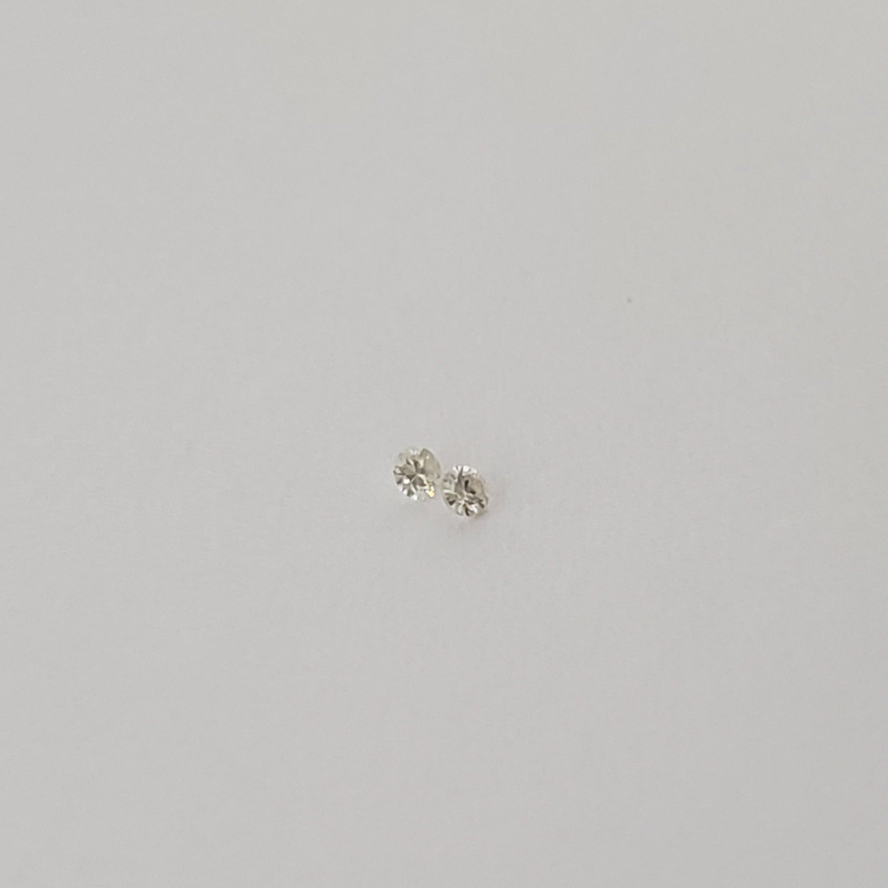 Pair of Moissanite | Round Diamond Cut | White | 1.2mm | SO24 3
