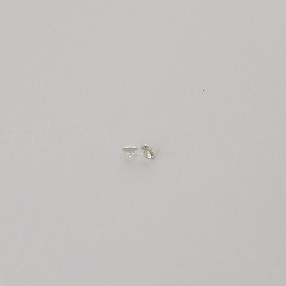  Pair of Moissanite | Round Diamond Cut | White | 1.2mm | SO24 4