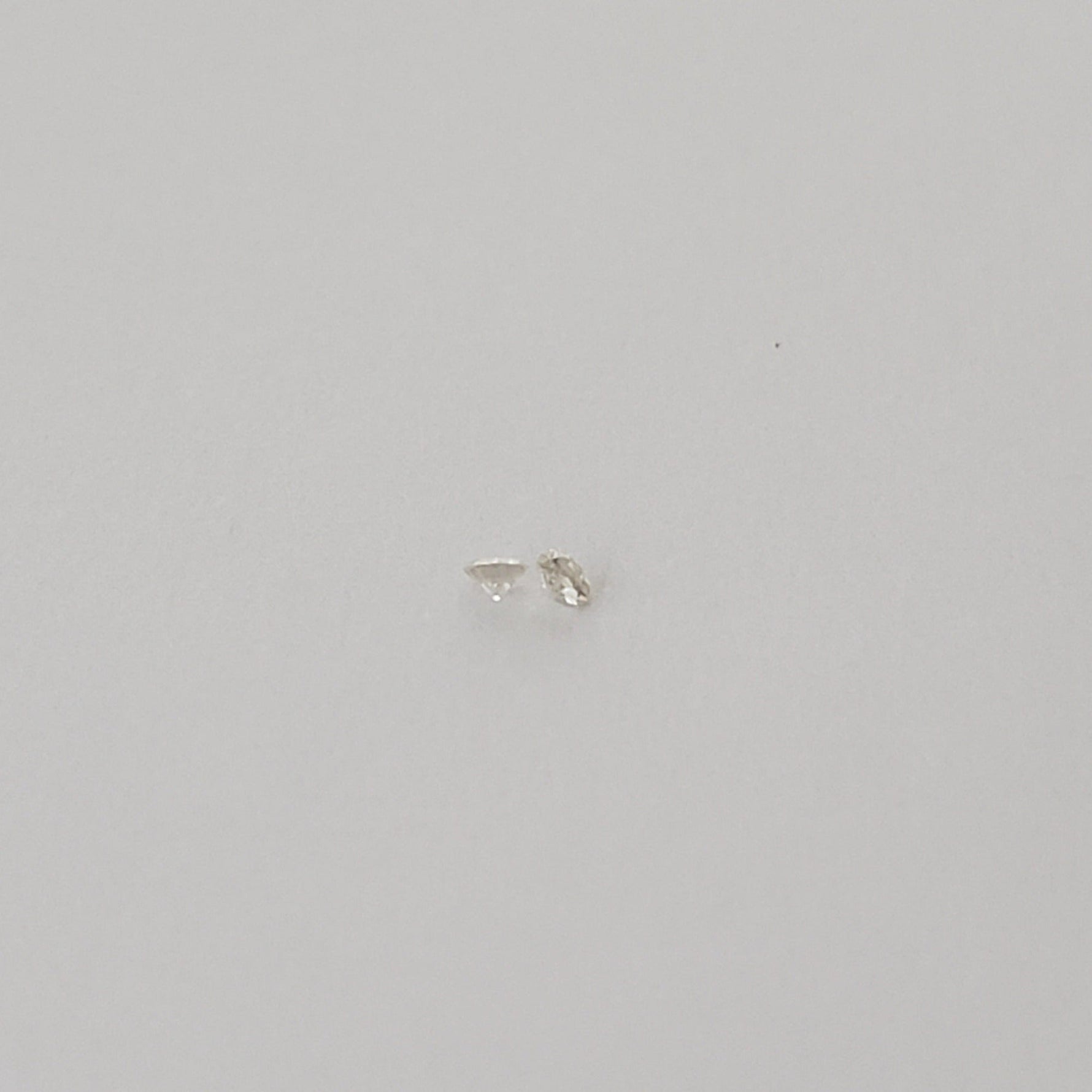  Pair of Moissanite | Round Diamond Cut | White | 1.2mm | SO24 4