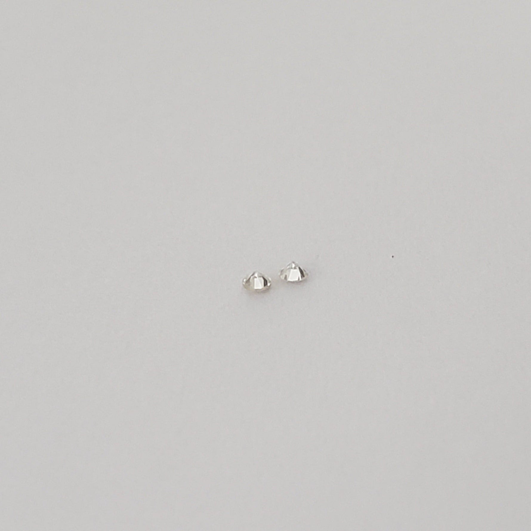  Pair of Moissanite | Round Diamond Cut | White | 1.2mm | SO24 5