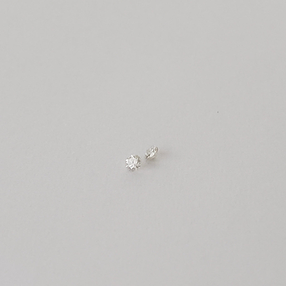  Pair of Moissanite | Round Diamond Cut | White | 1.2mm 