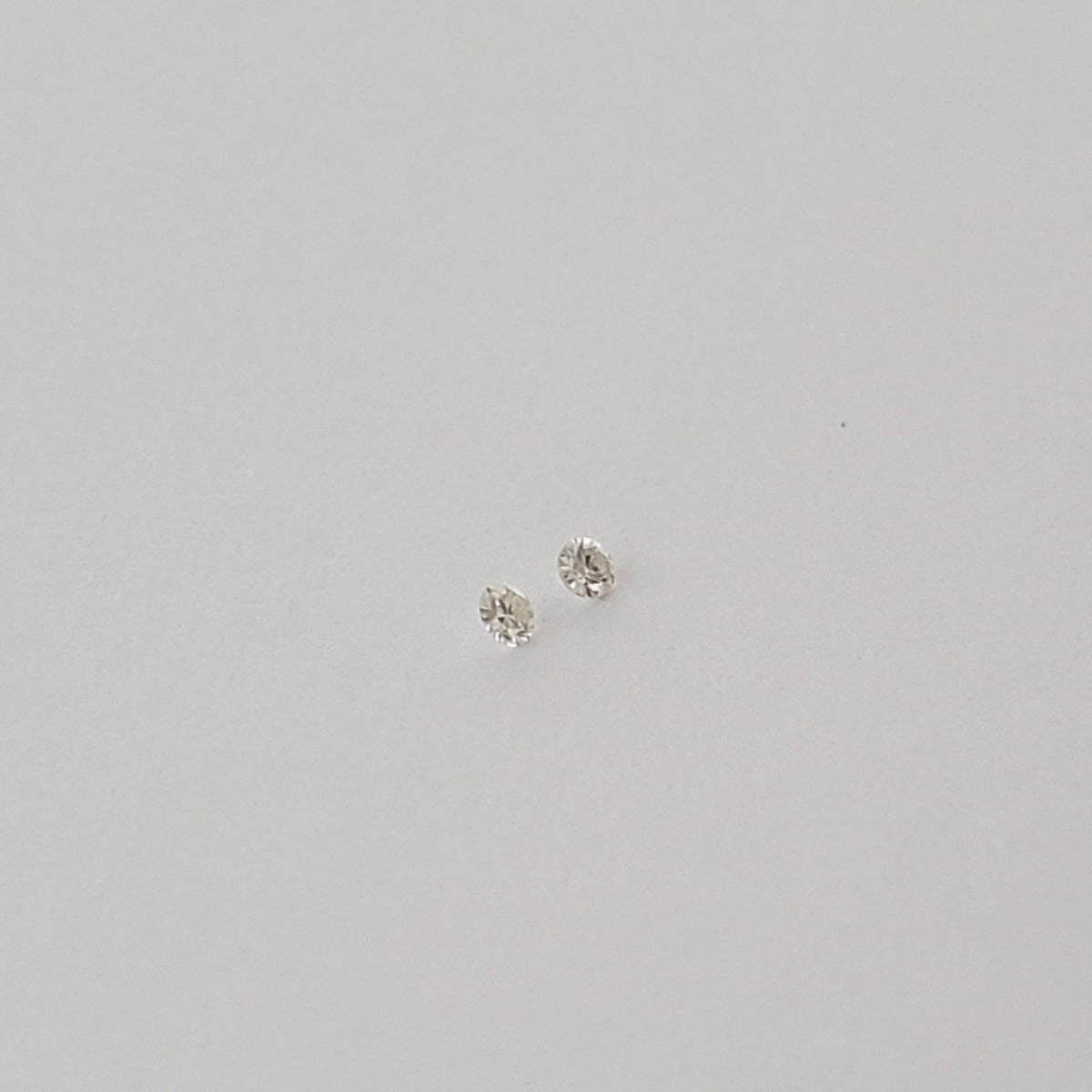  Pair of Moissanite | Round Diamond Cut | White | 1.2mm 