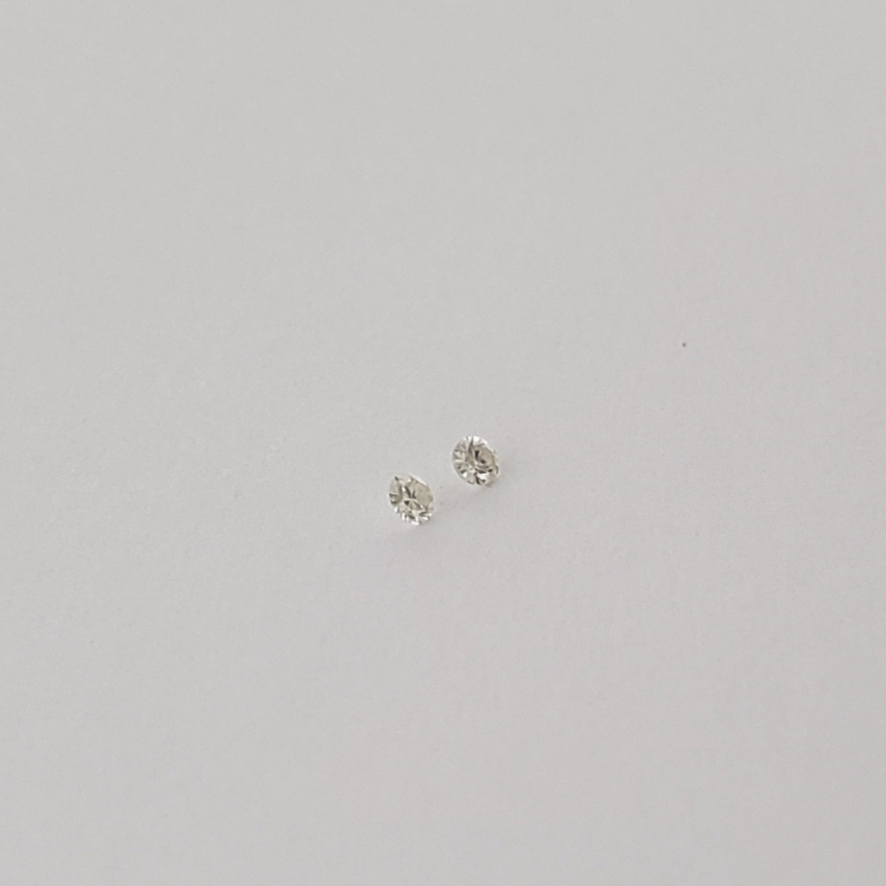  Pair of Moissanite | Round Diamond Cut | White | 1.2mm 