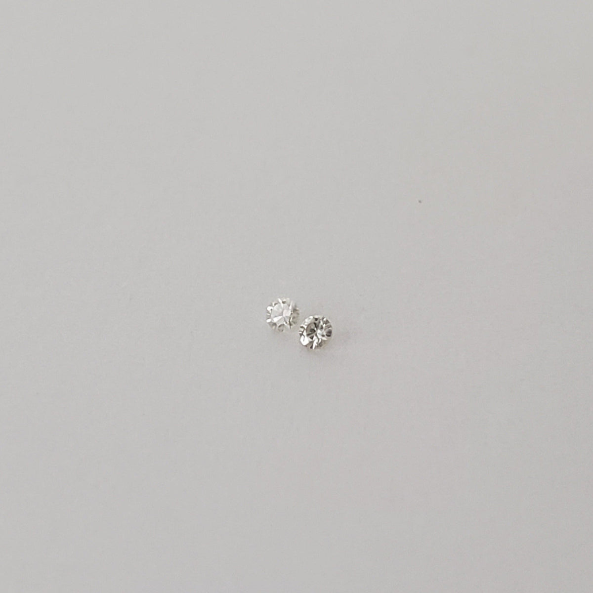  Pair of Moissanite | Round Diamond Cut | White | 1.2mm 