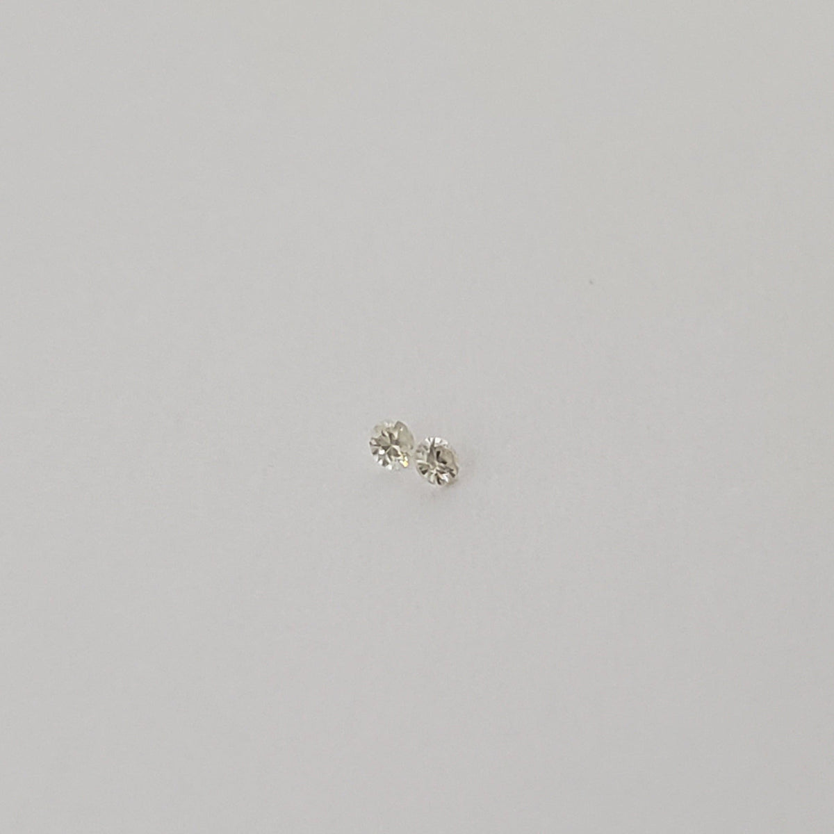  Pair of Moissanite | Round Diamond Cut | White | 1.2mm 