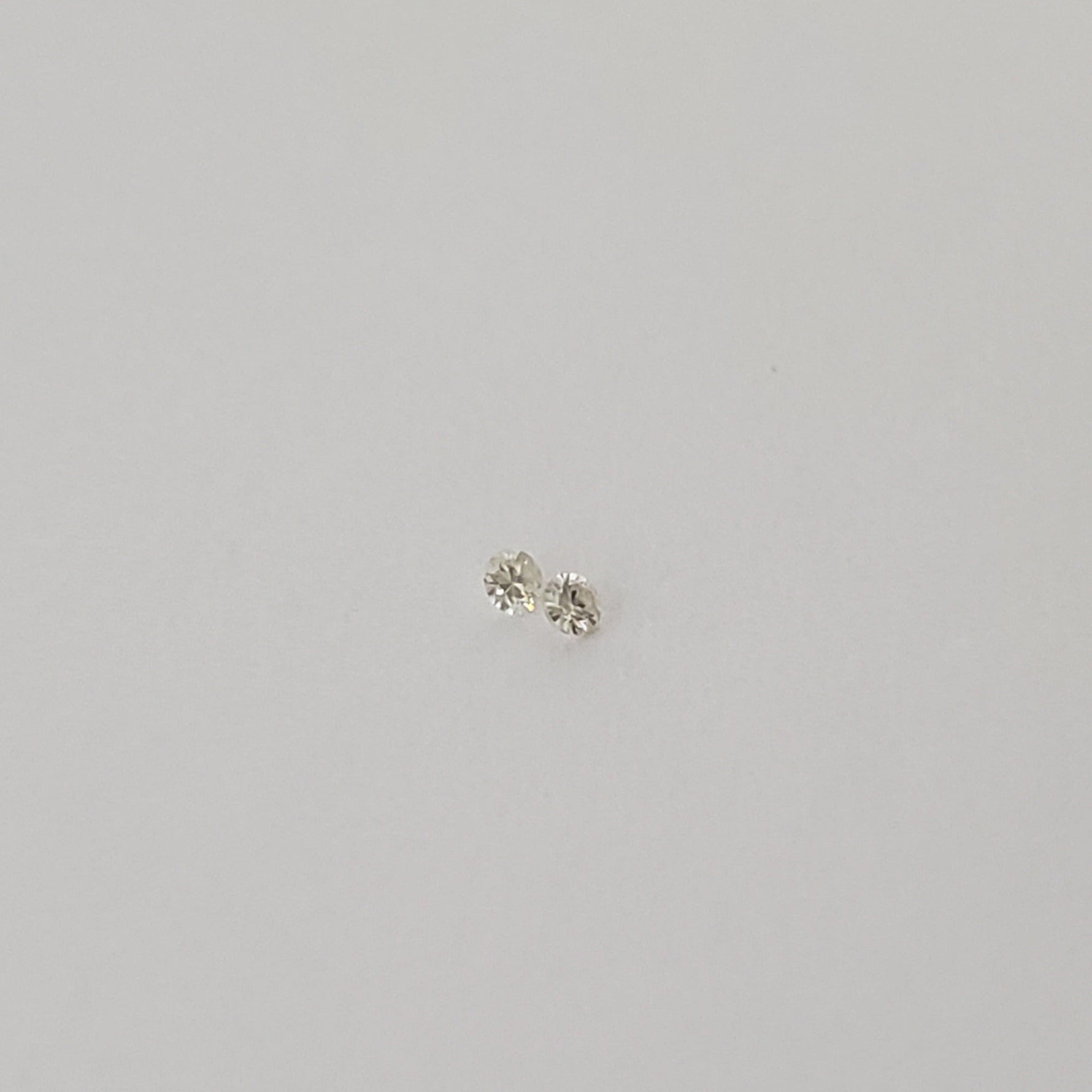  Pair of Moissanite | Round Diamond Cut | White | 1.2mm 