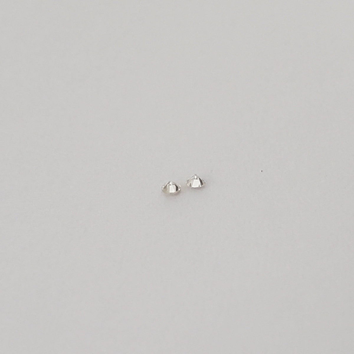  Pair of Moissanite | Round Diamond Cut | White | 1.2mm 