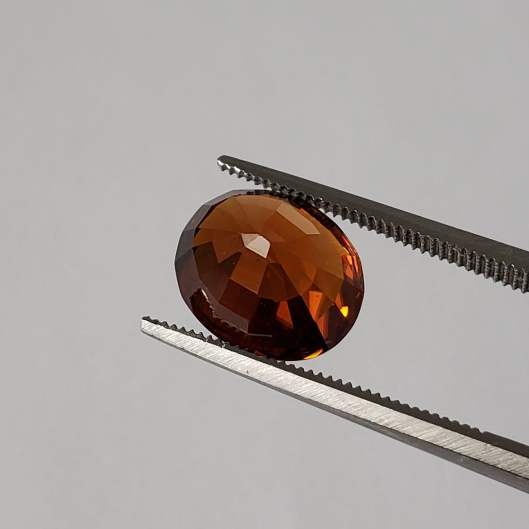 Zircon | Oval Cut | Imperial Orange | 10.8x9.3mm 6.11Ct | Vietnam | Canagem.com